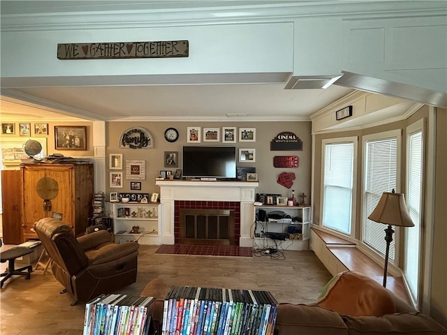 living room featuring ornamental molding and wood-type flooring