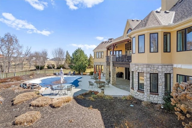 view of swimming pool featuring a patio and a fenced in pool