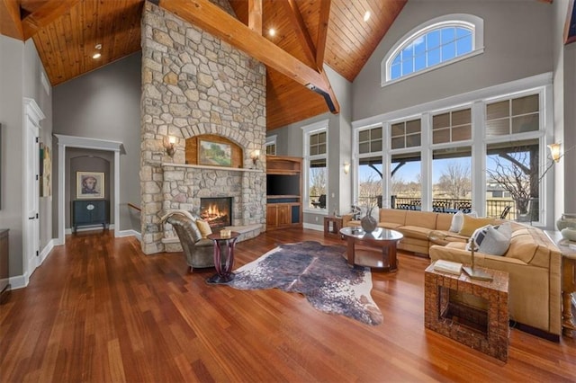 living room with wood finished floors, baseboards, high vaulted ceiling, a fireplace, and wood ceiling