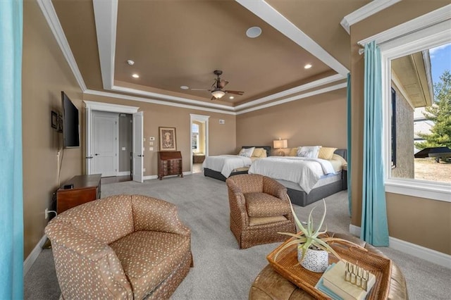 carpeted bedroom featuring recessed lighting, a tray ceiling, baseboards, and ornamental molding