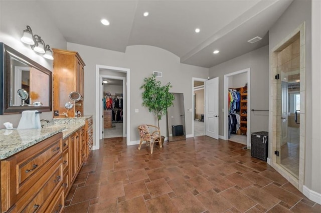 bathroom featuring recessed lighting, a shower stall, visible vents, and baseboards