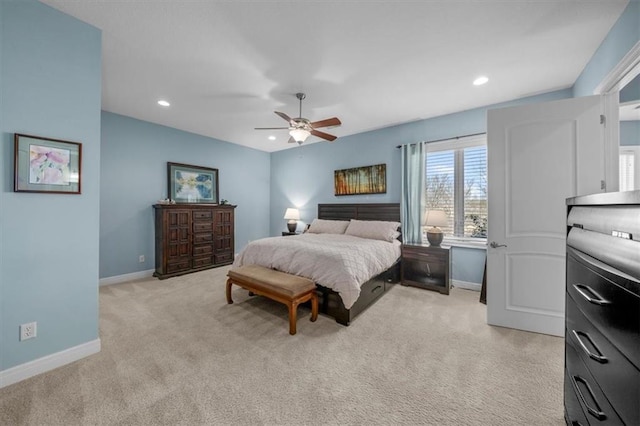 bedroom featuring recessed lighting, light colored carpet, baseboards, and ceiling fan