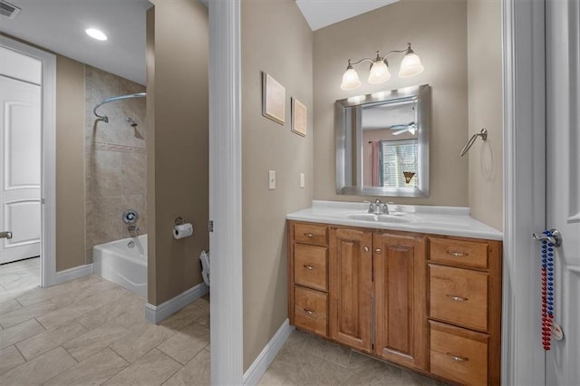 bathroom with visible vents, tile patterned flooring, tub / shower combination, baseboards, and vanity