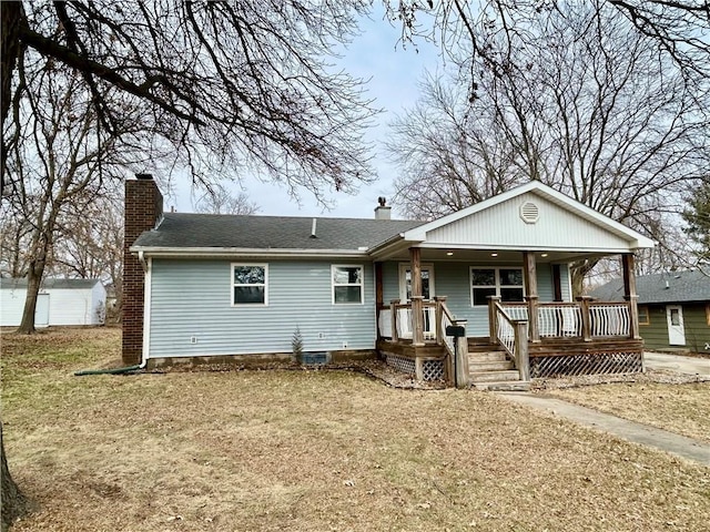 view of front of house featuring a front yard and a porch