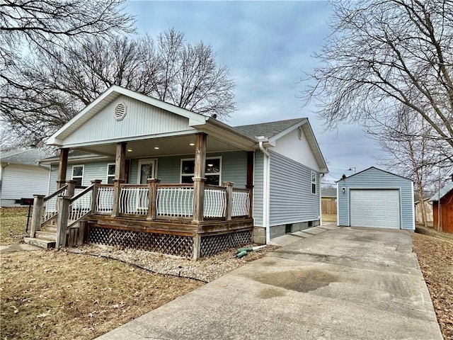 view of front of house with a porch, a garage, and an outbuilding