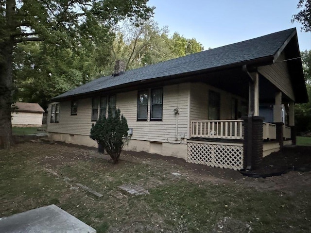 view of home's exterior featuring covered porch