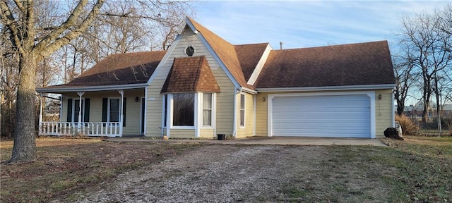 view of front of house featuring a garage and a porch