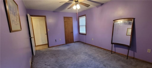 unfurnished bedroom with light colored carpet and ceiling fan