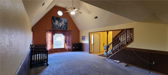 additional living space with ceiling fan, carpet flooring, and high vaulted ceiling