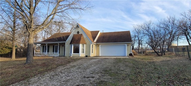 view of front facade featuring a garage and a porch