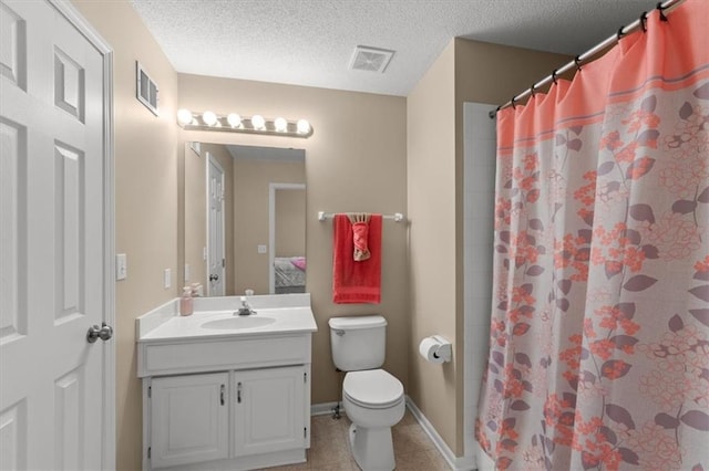 full bathroom featuring visible vents, toilet, tile patterned floors, a textured ceiling, and vanity