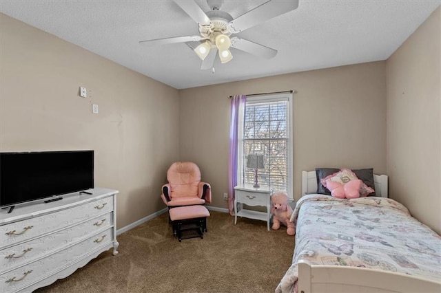 bedroom with ceiling fan, carpet floors, a textured ceiling, and baseboards