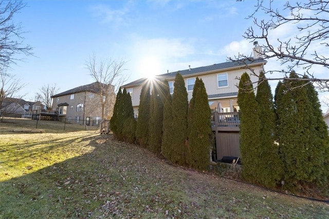 exterior space featuring a yard and fence