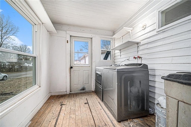 laundry room featuring washing machine and dryer and dark hardwood / wood-style floors