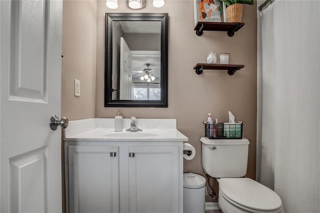 full bathroom with toilet, a ceiling fan, and vanity