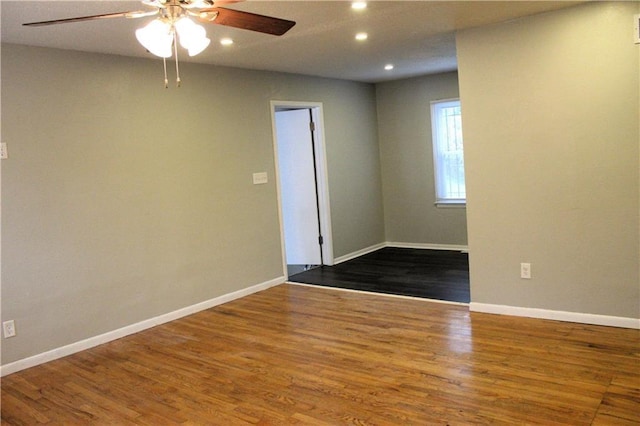 unfurnished room with ceiling fan and wood-type flooring