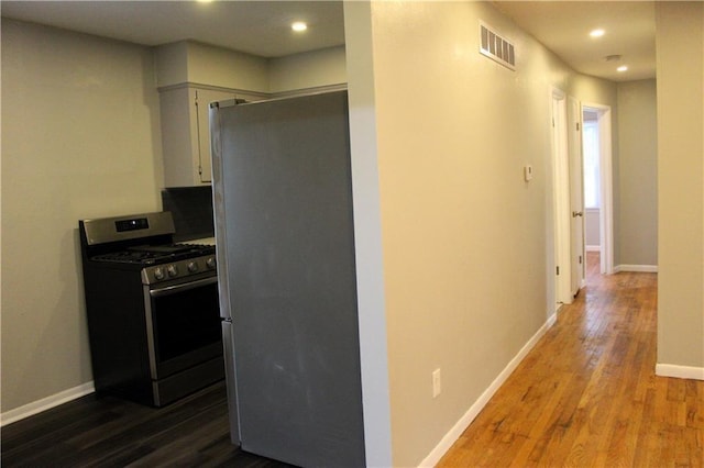 kitchen featuring wood-type flooring and appliances with stainless steel finishes