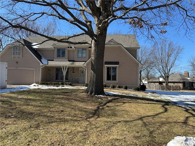 view of front of home with a garage, stone siding, a yard, and stucco siding