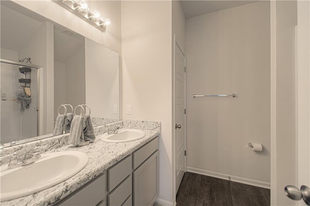 bathroom with vanity and hardwood / wood-style floors