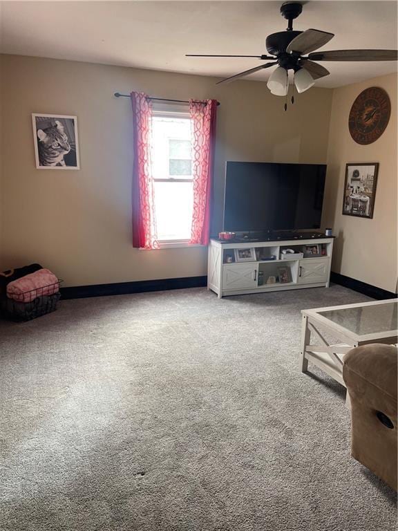 living room with carpet flooring and ceiling fan