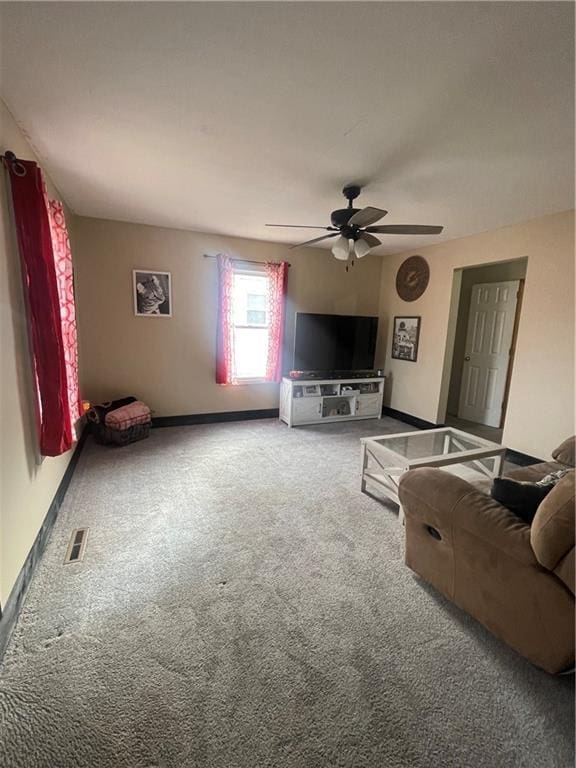 living room featuring carpet floors and ceiling fan