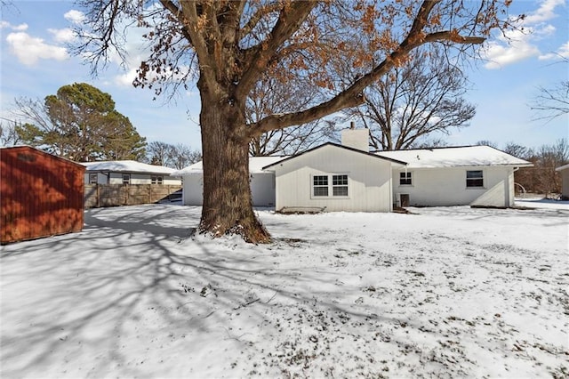 view of snow covered house