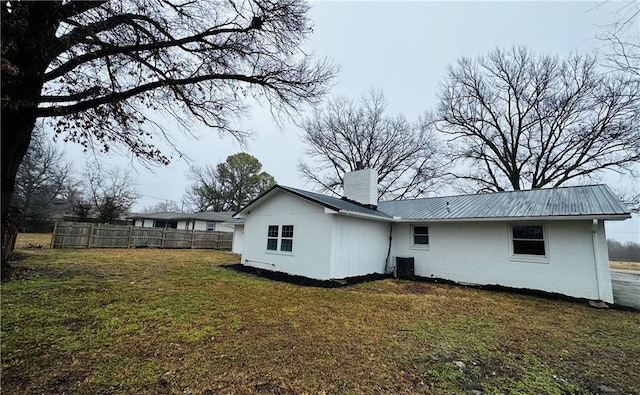 back of house with a yard