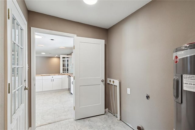 interior space with electric water heater and hookup for an electric dryer