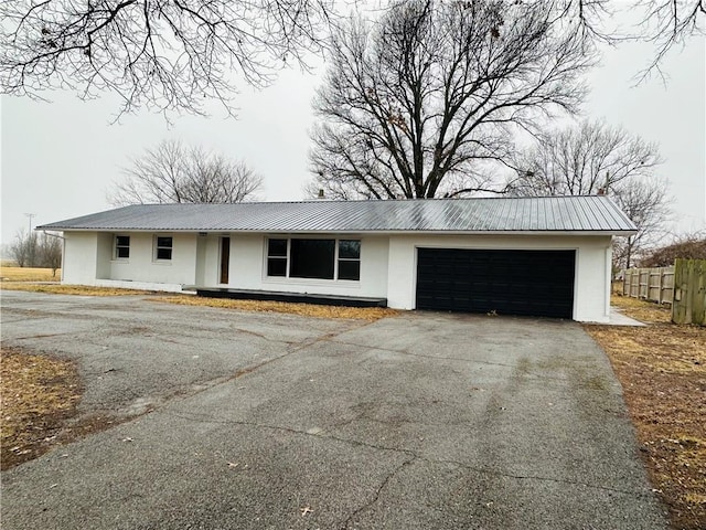 single story home featuring a garage