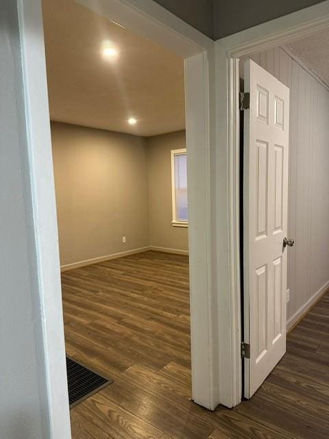 hall with dark hardwood / wood-style floors