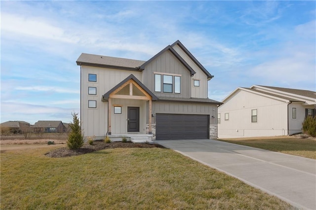 modern farmhouse featuring a garage, driveway, stone siding, a front lawn, and board and batten siding