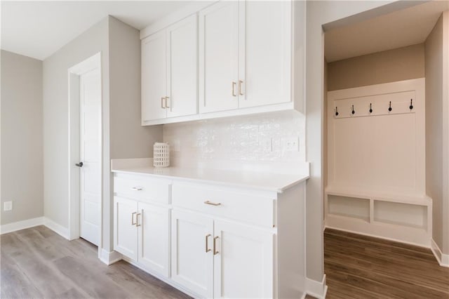 interior space with baseboards and light wood-style floors