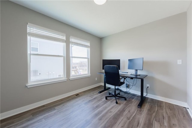 office featuring wood finished floors and baseboards