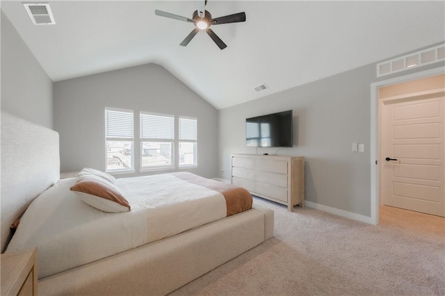 carpeted bedroom featuring visible vents, vaulted ceiling, and baseboards