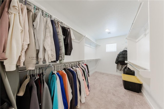 spacious closet featuring carpet floors and visible vents