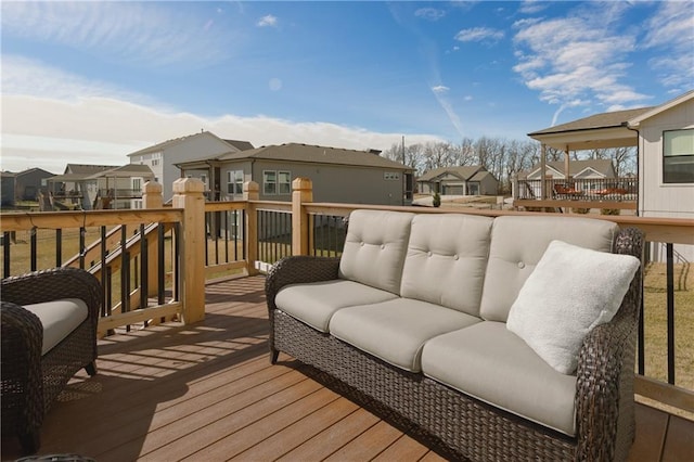 wooden terrace featuring a residential view and an outdoor hangout area