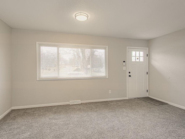 entryway featuring carpet floors