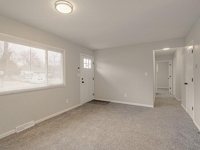 view of carpeted foyer