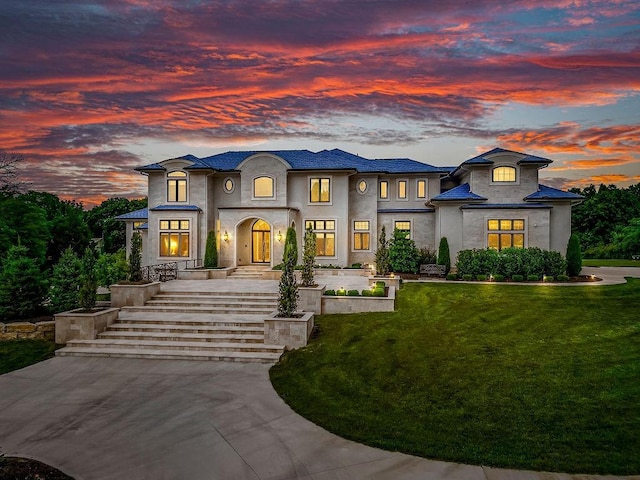 view of front of house featuring a front yard and stucco siding