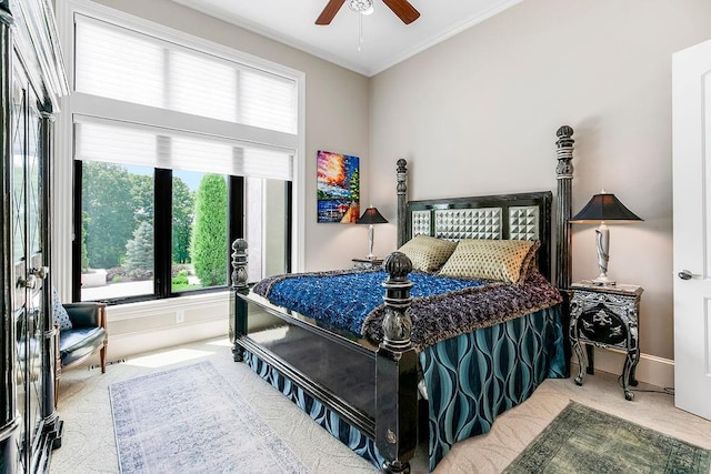 bedroom featuring ornamental molding, carpet, a ceiling fan, and baseboards