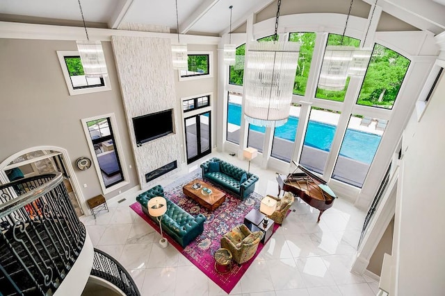 living room with high vaulted ceiling, a fireplace, beamed ceiling, and baseboards