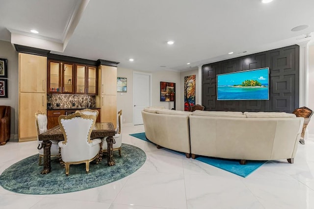 interior space featuring marble finish floor, crown molding, and recessed lighting