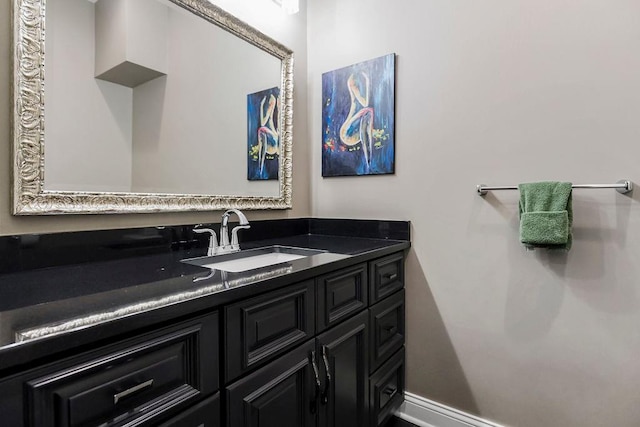 bathroom featuring vanity and baseboards