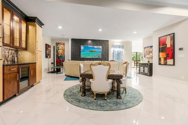 dining room with recessed lighting, beverage cooler, marble finish floor, and baseboards