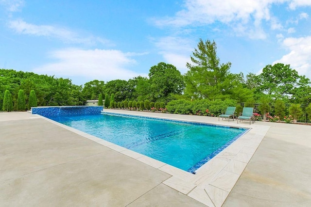 outdoor pool featuring a patio area