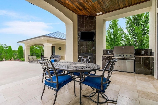 view of patio featuring a grill and outdoor dining area