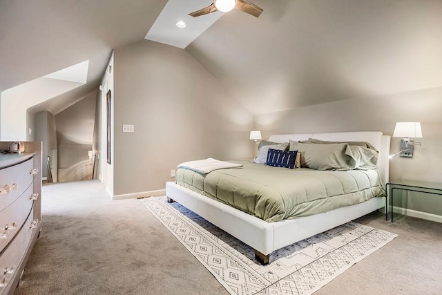 bedroom featuring a ceiling fan, light colored carpet, vaulted ceiling, and baseboards