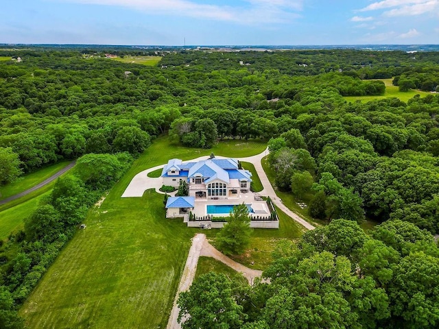 drone / aerial view with a view of trees