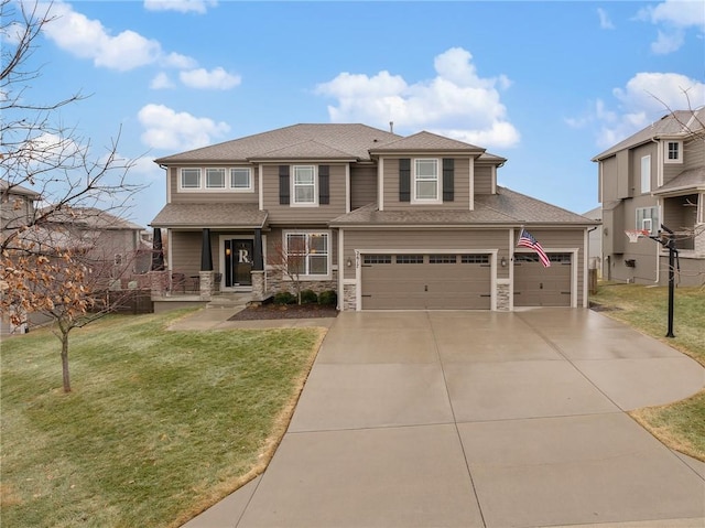 view of front of house featuring a garage and a front yard