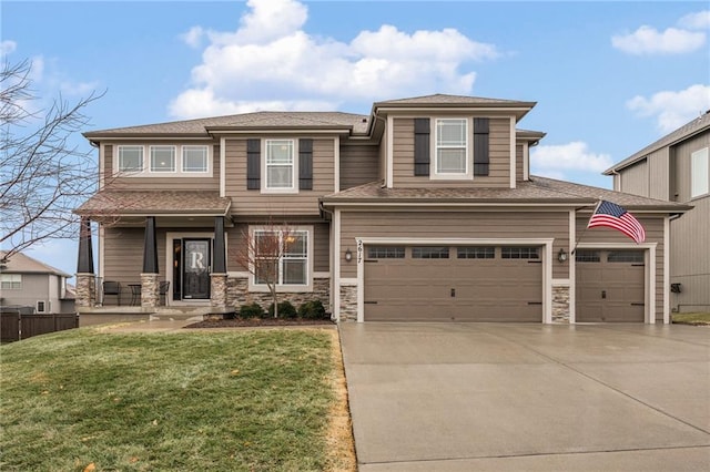 view of front of home with a garage and a front lawn